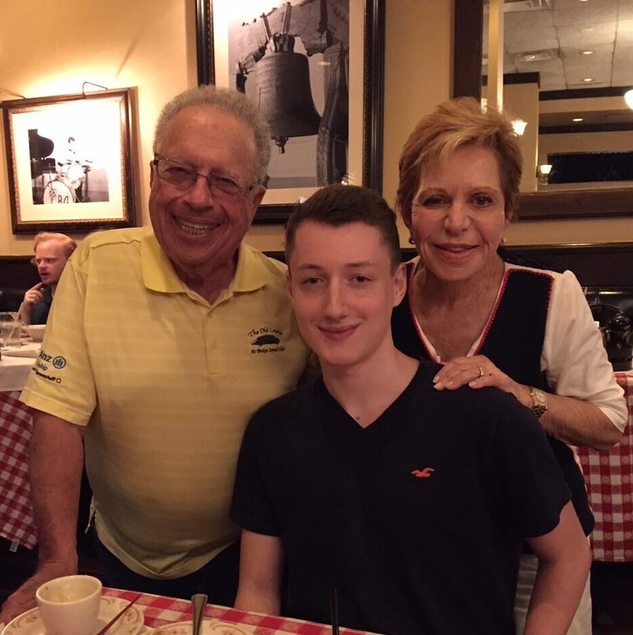 Elliot with his grandparents at a family gathering.