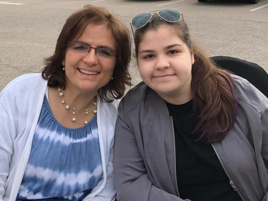 Marybeth Caldarone and her daughter Grace smiling together.