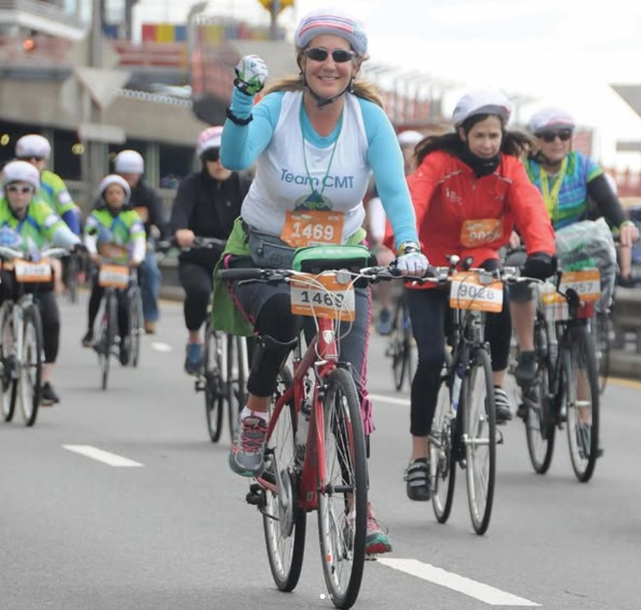 Allison Moore riding with Team CMT, wearing bib number 1469.