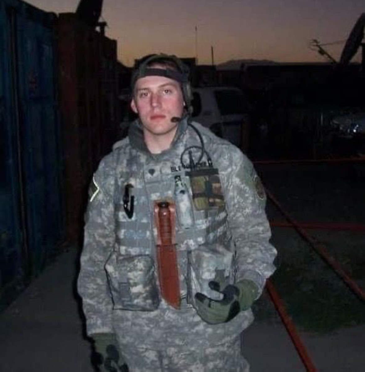 A young Daniel Blevins in military uniform with a radio headset, from his years of service.