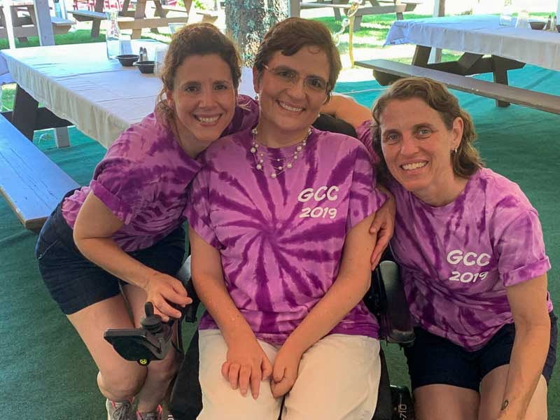 Grace with volunteers in Grace's Courage Crusade shirts.