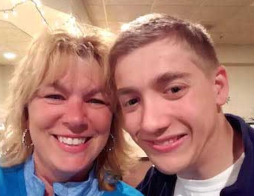 Zach smiling with a friend.