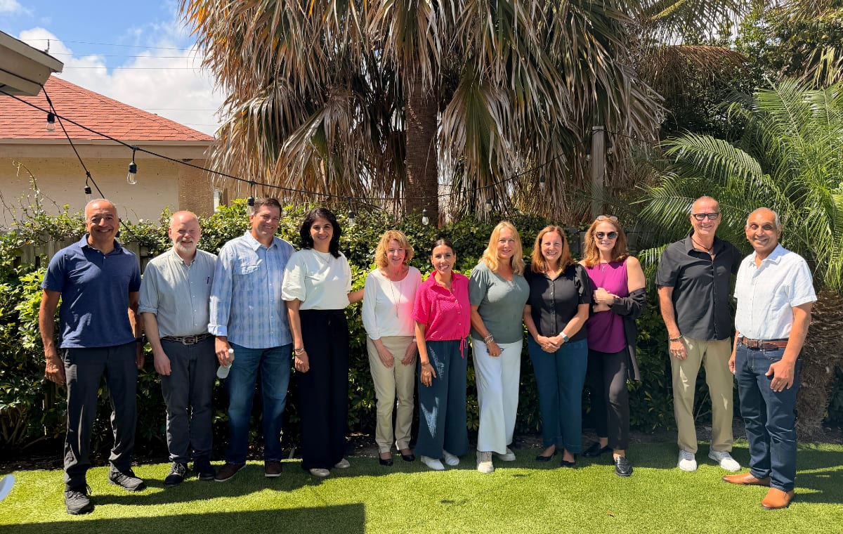 HNF board members and leadership gathered outdoors at a board retreat.