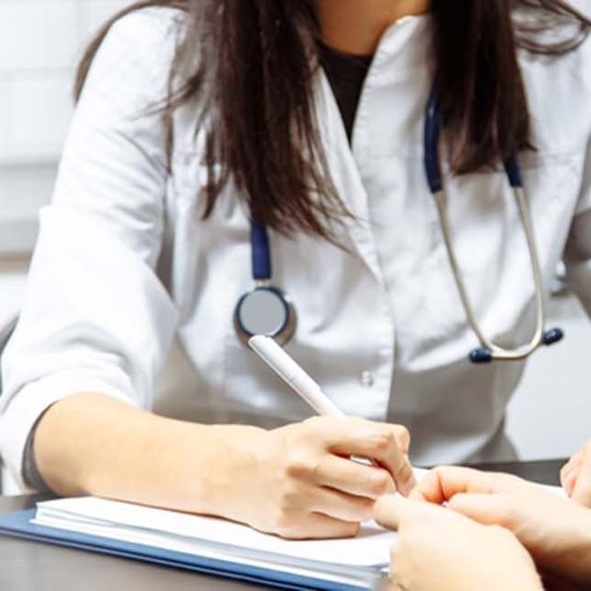 A person reading through CMT information at the start of their diagnosis journey.