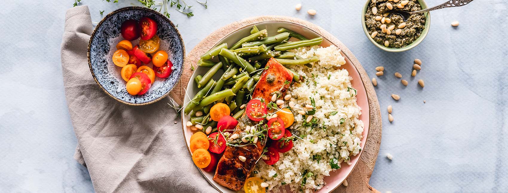 Bowls of fresh, colorful whole foods on a table.